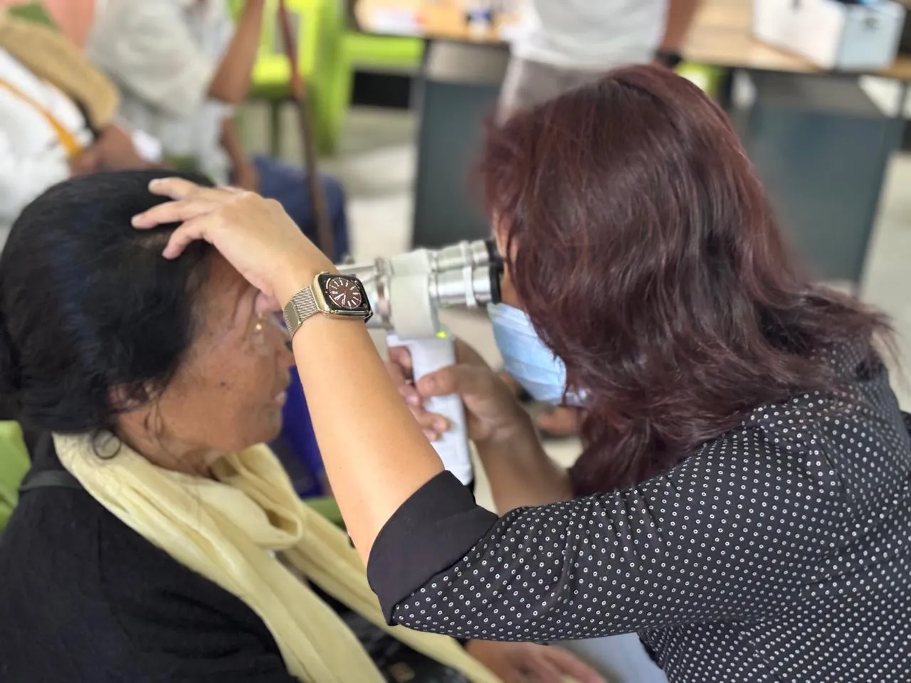 Patients expressing happiness after receiving free medications.